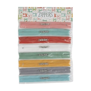 May include: A package of colorful zippers in various shades, including pink, teal, red, white, green, yellow, gray, and blue. Each zipper has a silver metal pull and is packaged in a clear plastic bag. The header card reads "Zippers".