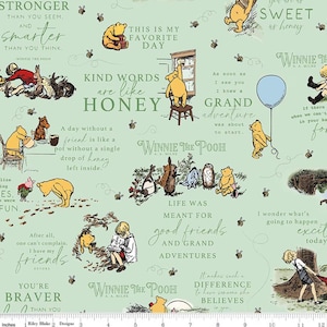 May include: A light green fabric featuring illustrations of Winnie the Pooh and friends. The design includes quotes and phrases like "Kind words are like honey" and "Life was meant for good friends and grand adventures."