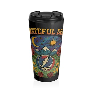 May include: Black travel mug with a lid featuring a colorful graphic. The design includes the text "Grateful Dead" above a scene with a moon, stars, mountains, and roses. A skull with a lightning bolt is in the center, surrounded by dancing bears.