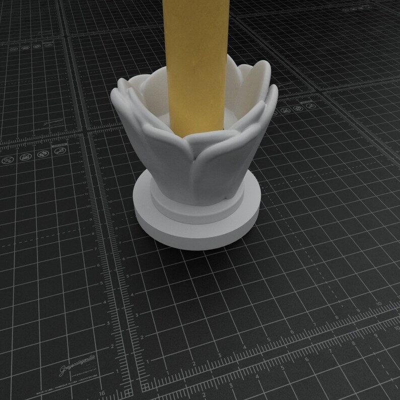 May include: White ceramic candle holder shaped like a flower with a round base. The candle holder is empty and has a yellow candle inside.