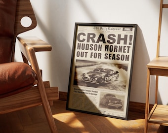 May include: A vintage newspaper headline announcing the "CRASH!" of the Hudson Hornet, with a black and white photo of the car in a cloud of smoke. The headline reads "Hudson Hornet Out For Season".