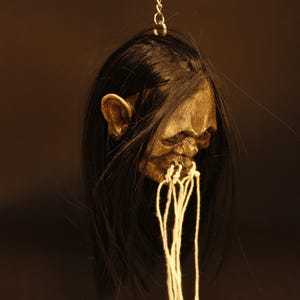 Réplica de cabeza reducida