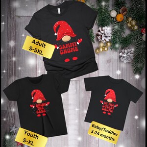 May include: Three black t-shirts with a gnome graphic and Christmas-themed text. The adult shirt says "Jammy Gnome", the youth shirt says "Bring the Sass", and the baby/toddler shirt says "I'm the Cutest Gnome".