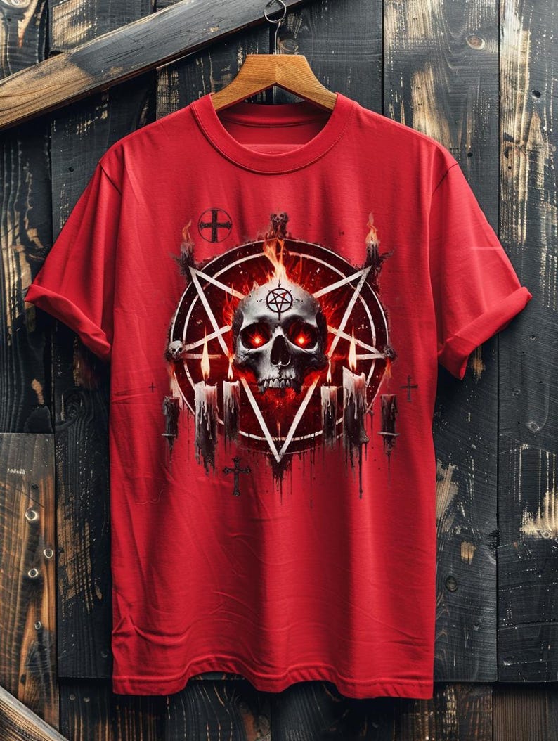 May include: Red t-shirt with a graphic print of a skull in a pentagram surrounded by flames and candles.