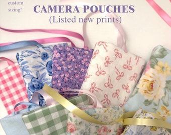 May include: A collection of fabric camera pouches featuring various floral, gingham, and bow patterns in shades of pink, blue, green, and white. Each pouch includes a ribbon tie. Text reads: BOW DIGITAL CAMERA POUCHES (Listed new prints) I do custom sizing!