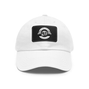 May include: White baseball cap with a black patch featuring a white logo that says "Better Living GT It's not fitness, it's life".
