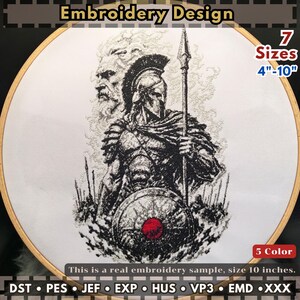 May include: An embroidery design in a wooden hoop featuring a black and white Spartan warrior with a spear and shield, a ghostly figure behind, and a red circle on the shield. Text includes Embroidery Design, 7 Sizes 4-10 inches, and file formats.