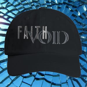 May include: Black baseball cap with the word "FAITHVOID" embroidered in a light gray color. The hat has a curved brim and a classic six-panel design. The text is in a stylized font.