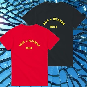 May include: Two t-shirts, one red and one black, with the text "WEIS + HICKMAN RULE" in yellow.