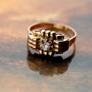 Rare "Tank" ring in 750 thousandths yellow and white gold from the 1950s, decorated with a solitaire diamond.