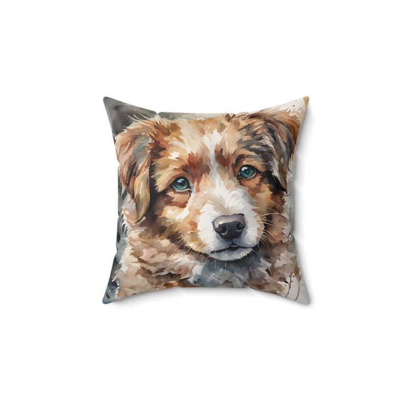 Pillow, featuring a beautiful watercolor rendition of a sweet, charming and friendly puppy. It captures the innocent gaze and soft, fluffy fur of a young pup in a cascade of vibrant watercolor splashes, blending natural hues with a touch of artistry.