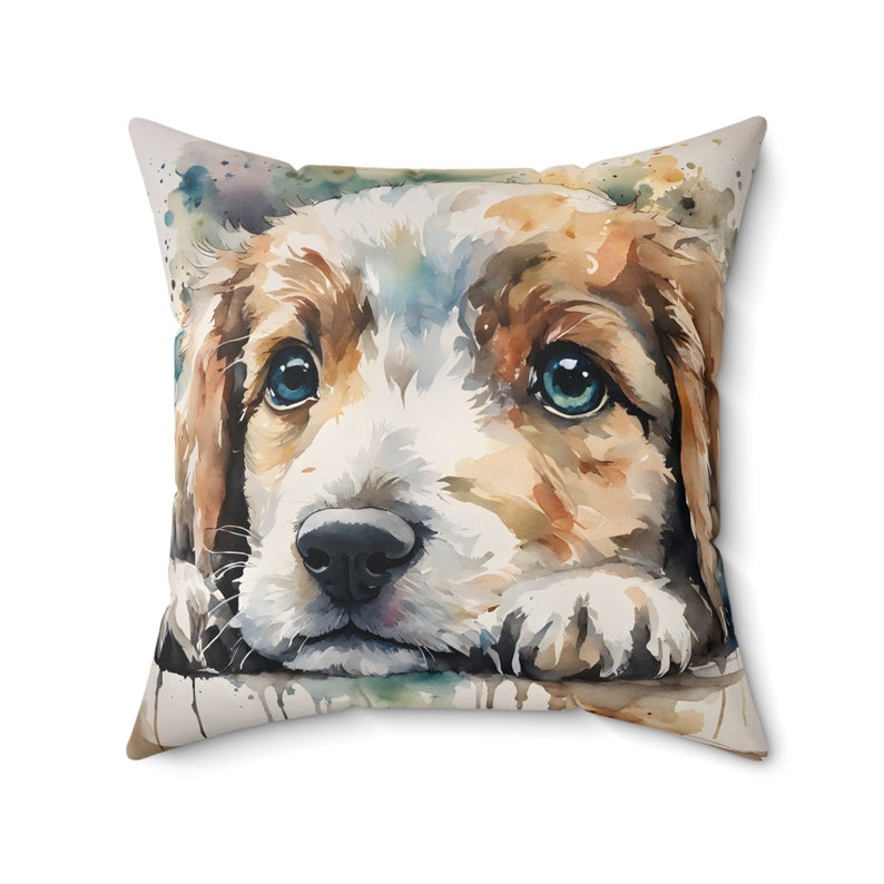 Pillow, featuring a beautiful watercolor rendition of a sweet, charming and friendly puppy. It captures the innocent gaze and soft, fluffy fur of a young pup in a cascade of vibrant watercolor splashes, blending natural hues with a touch of artistry.