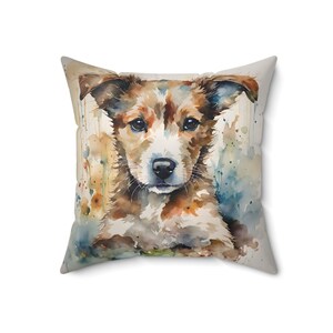 Pillow, featuring a beautiful watercolor rendition of a sweet, charming and friendly puppy. It captures the innocent gaze and soft, fluffy fur of a young pup in a cascade of vibrant watercolor splashes, blending natural hues with a touch of artistry.