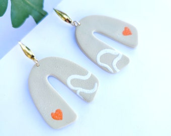 Polymer clay dangling earrings, heart pattern, beige color