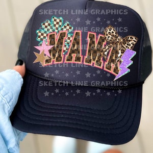 May include: Black trucker hat with a white "MAMA" graphic with pink, blue, and brown accents. The hat also features a checkered pattern, a leopard print bow, a star, and a lightning bolt.