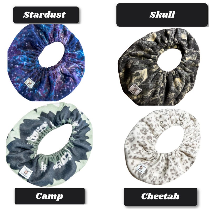 May include: Four circular fabric covers with elastic edges, each featuring a distinct pattern: a blue and purple galaxy print labeled Stardust, a black and gray skull print labeled Skull, a green and black camping scene labeled Camp, and a white and gray cheetah print labeled Cheetah.