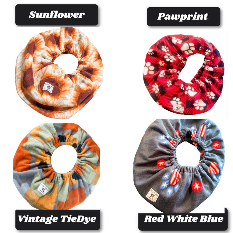 May include: Four circular fabric bowl covers with elastic edges. Top left features a sunflower print. Top right shows a red and black plaid pattern with white paw prints. Bottom left has a vintage tie-dye design. Bottom right displays a gray fabric with red, white, and blue star and heart motifs.