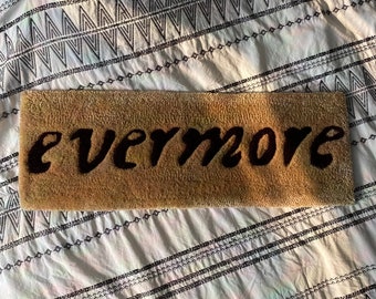 evermore title wall rug