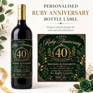 May include: A dark wine bottle with a gold foil top and a rectangular label featuring a dark green background, gold ornate borders, and gold text reading Happy Ruby Anniversary 40 Years Together Michael & Elizabeth 12th August 1986 With Love.