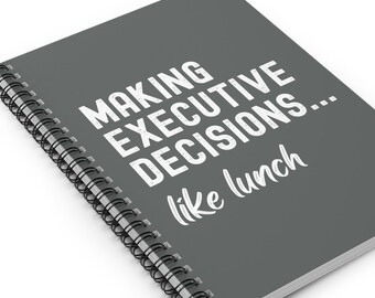May include: Grey spiral bound notebook with the text "MAKING EXECUTIVE DECISIONS... like lunch" in white.