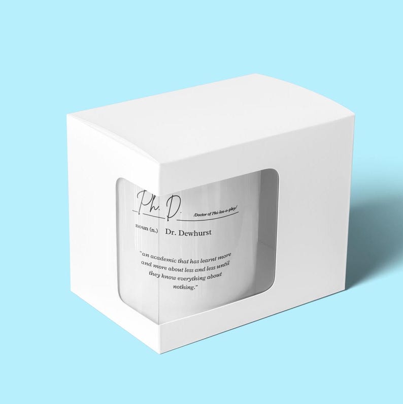 May include: White mug with a black and white design that reads "Ph.D. noun (n.) Dr. Dewhurst "an academic that has learnt more and more about less and less until they know everything about nothing."