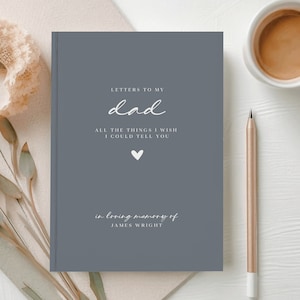 May include: A grey journal with the text "LETTERS TO MY dad ALL THE THINGS I WISH I COULD TELL YOU" and a small white heart. The text "in loving memory of JAMES WRIGHT" is at the bottom of the journal.