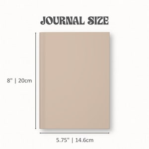 May include: A beige journal with the text "JOURNAL SIZE" at the top. The journal is 8 inches (20cm) tall and 5.75 inches (14.6cm) wide. The journal has a smooth, solid cover.