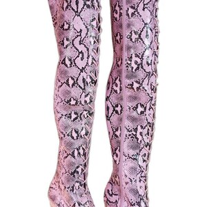 May include: Pink snakeskin thigh-high boots with a lace-up front and a thick platform heel.
