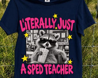May include: A navy blue t-shirt featuring a black and white graphic of a raccoon wearing sunglasses and holding a plastic cup with a straw. The text "LITERALLY JUST A SPED TEACHER" is printed in large pink letters, accented by yellow stars.