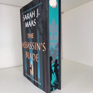 The Assassin&#39;s Blade by Sarah J Mass sprayed edge book, stenciled edge book, foredge painting, special edition book, TOG, book merch, Acotar