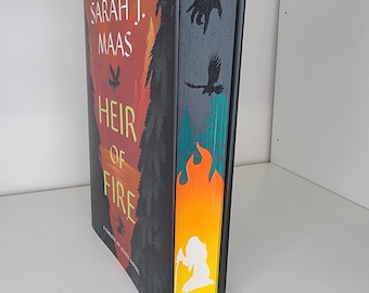 Libro Heredero del Fuego con bordes pintados, bordes con plantilla, pintura en el canto, libros de edición especial, decoración literaria, bordes pintados a medida, merchandising literario