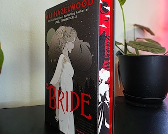 Bride by Ali Hazelwood sprayed edges book, stenciled edges, special edition book, book merch, fore edge painting, painted edges, bookish