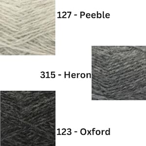 May include: Three yarn samples in different shades of gray. The top sample is a light gray called "127 - Peebles". The middle sample is a medium gray called "315 - Heron". The bottom sample is a dark gray called "123 - Oxford".