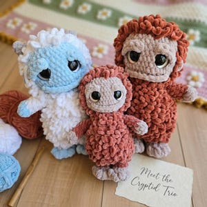 May include: A white ceramic mug with a black handle and the text "But First, Coffee" in a bold, black font. The mug is set against a blurred background, suggesting a cozy setting. The mug appears to be approximately 4 inches tall.