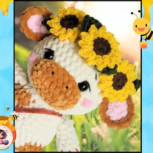 May include: A crocheted plush cow toy with brown and white fur, wearing a sunflower crown. The cow has large, black eyes and a pink nose.
