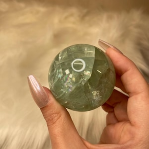 Rainbow filled fluorite sphere