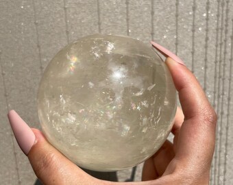 Large rainbow filled honey calcite sphere