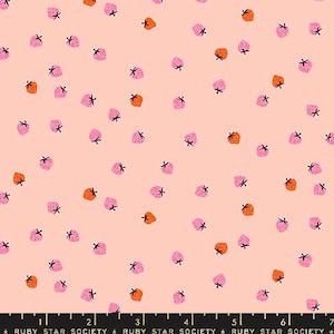 May include: A fabric with a repeating pattern of pink and orange strawberries with black stems scattered on a light peach background. The strawberries are stylized and evenly spaced across the fabric.