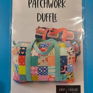 May include: A sewing pattern for a Patchwork Duffle bag by Knot + Thread Design. The cover features a quilted duffle bag made of colorful fabric squares with light blue handles, and a second darker bag with a typewriter print in the background.