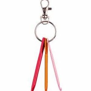 May include: A keychain with three brightly colored crochet hooks: red, orange, and pink. The hooks are attached to a silver ring and a lobster clasp. The hooks are made of metal.