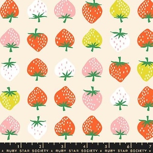 May include: A repeating pattern of stylized strawberries in various colors, including red, pink, white, and yellow, on a cream background. The strawberries have green stems and are arranged in a grid. The text "RUBY STAR SOCIETY" is at the bottom.