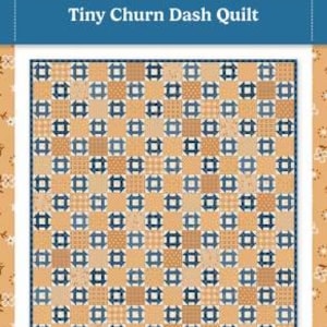 May include: A quilt pattern titled Tiny Churn Dash Quilt by Bluebird Patterns. The design features a grid of alternating tan and blue blocks with various small-scale prints. The finished quilt size is listed as 42.5 inches by 48.5 inches.