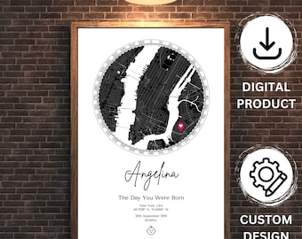 May include: A framed black and white map print of New York City, with a red heart marker. The print includes the name "Angelina", the text "The Day You Were Born", and the date and time. The frame is brown.
