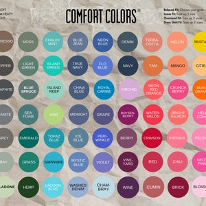 May include: A color chart featuring the "Comfort Colors" brand, showcasing a wide array of hues. The chart includes colors like "Black", "White", "Denim", "Mustard", and "Neon Pink", with text indicating fit and feel.