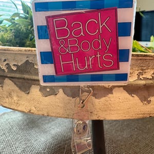 Back and body hurts badge reel
