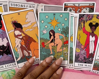 May include: A spread of tarot cards featuring colorful illustrations of people and symbols. The cards include The Lover, Strength, The Star, The Magician, and Ace of Pentacles.