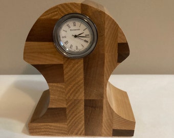 Desk clock featuring oak, walnut and maple, it includes a Waterford clock movement. Its stylish design compliments any décor.