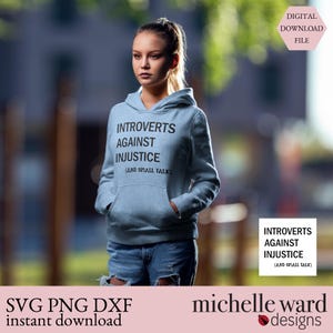 May include: A light blue hoodie with the text "INTROVERTS AGAINST INJUSTICE (AND SMALL TALK)". The hoodie is worn by a person in blue jeans. The image also includes the text "SVG PNG DXF instant download" and "michelle ward designs".