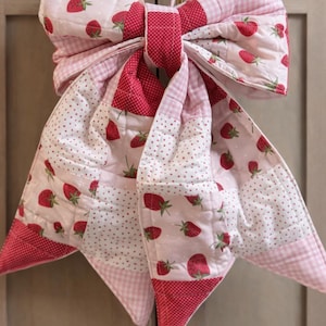 Quilted bow for door/baby’s room. Cherry patch work