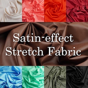 Op de afbeelding: Een collage van stretchstof met satijneffect in diverse kleuren, waaronder crème, koraal, oranje, rood, bruin, lichtblauw, mintgroen, olijfgroen en zwart. De bruine stof in het midden bevat de witte tekst Satin-effect Stretch Fabric.